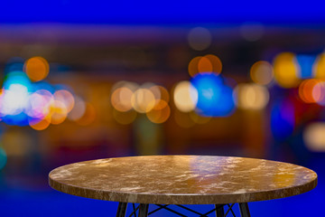 3D Rendering,Empty marble table for display of products in front of restaurant , night bar or night club abstract blur background,empty copy space for party, promotion social media banners, posters
