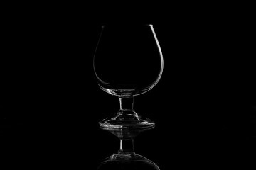 Empty glass silhouette isolated on black background