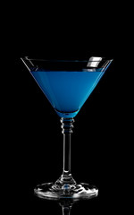 Close up of blue curacao drink. Blue lagoon cocktail in glass