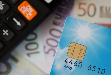 Euro money with calculator and credit card