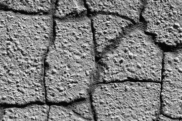 Texture of gray cracked asphalt. Abstract backdrop for design.