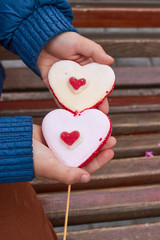 two heart candy,holding boy candy heart shape,Two heart-shaped candy, Valentines Day background