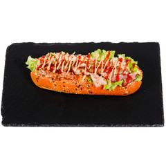 Hot dog on a black plate