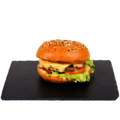 Tasty Burger on a plate in cafe.