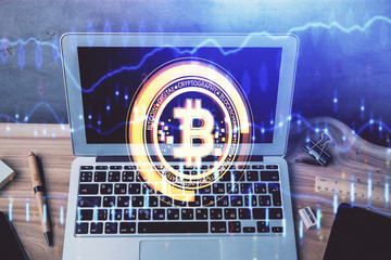 Double exposure of blockchain theme hologram and table with computer background. Concept of bitcoin...
