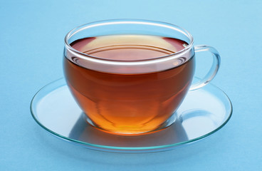 Cup of tea on a blue background.