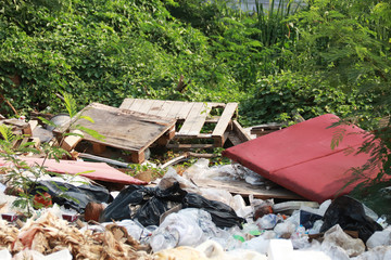 Mountain garbage in the forest. Garbage in the forest - dump in the woods