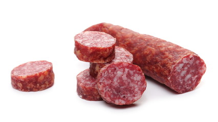 Fermented, dry sausage with chopped slices isolated on white background