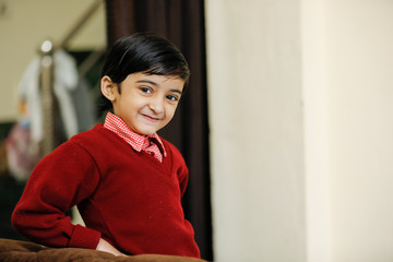 Indian little girl in school uniform and showing expression 