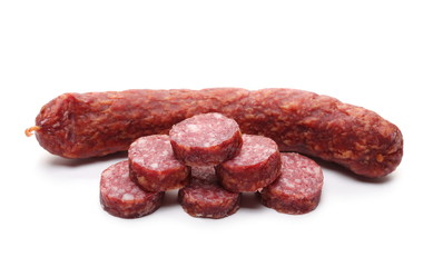 Fermented, dry sausage with chopped slices isolated on white background