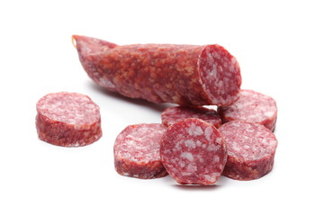 Fermented, dry sausage with chopped slices isolated on white background