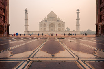 Fototapeta na wymiar Left side of the Taj Mahal in Agra, India, on overcast morning with smog