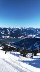 Fototapeta na wymiar Austria - Zell Am See. View from the top of the mountain. on lake. Blue cloudless sky