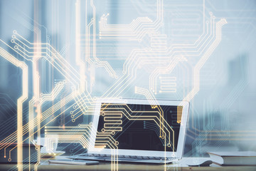 Computer on desktop in office with technology theme hologram. Multi exposure. Tech concept.