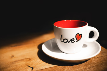 Valentine mug on wooden table. Love and red heart . Valentine decorative.