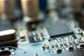 Close up macro shooting computer circuit mainboard integrated elements. Shallow depth of field. Science and technology concept.