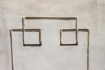 Geometric pattern on the wall. Squeezed line in concrete. Right angles in the decoration.