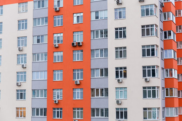 Fototapeta na wymiar Fragment of facade of the modern multistory residential house