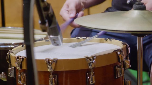 Playing Drums with Brushes in Sound Recording Studio