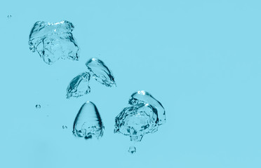 Blue water bubble background. Underwater splash in clear liquid.
