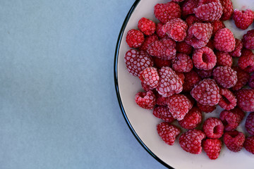 Frozen raspberries on a plate