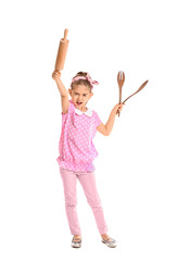 Little housewife with kitchen utensils on white background