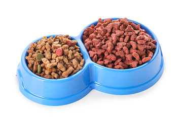 Bowls with dry pet food on white background
