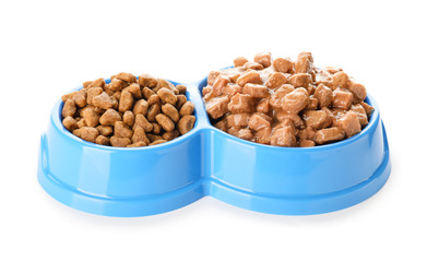 Bowls with pet food on white background