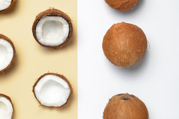Fototapeta na wymiar Ripe coconuts on color background