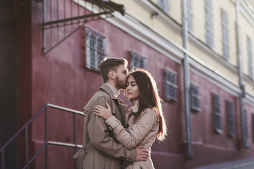 Close up of loving couple kissing and hugging in the city