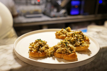 Close up Striped shell topped on Baked garlic butter bread