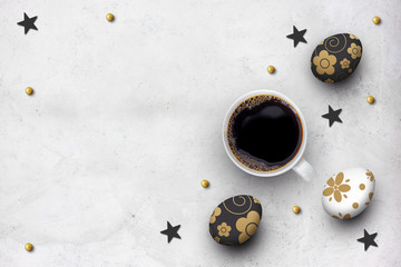 easter eggs and hot coffee cup on cement floor background