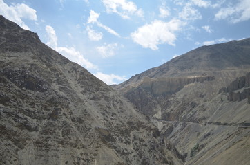 the view of Himalaya mountains on a sunny day under the blue sky in the morning or the evening in Tibet India China the road on high altitudes