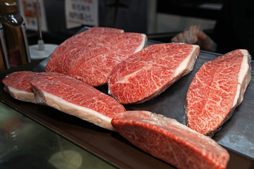 Close up Sliced Wagyu dry aged beef on display shelf at Japanese supermarket