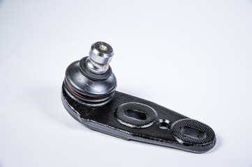 New spare parts spherical ball joints of a suspension bracket of a car on a gray background