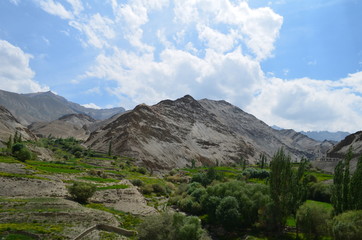 the view of Himalaya mountains on a sunny day under the blue sky in the morning or the evening in Tibet India China the road on high altitudes