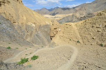 the view of Himalaya mountains on a sunny day under the blue sky in the morning or the evening in Tibet India China the road on high altitudes