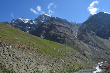 the view of Himalaya mountains on a sunny day under the blue sky in the morning or the evening in Tibet India China the road on high altitudes