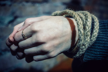 Hands of a bound girl close-up. Concept of kidnapping, violence