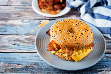 Fried bacon cheese egg salad bagel