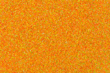 Perfect new texture, holographic glitter background in warm orange color.