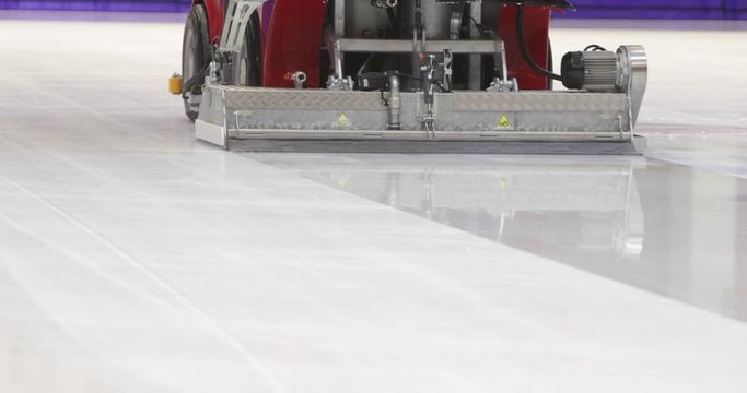 Footage of an ice-resurfacing machine polishing the rink