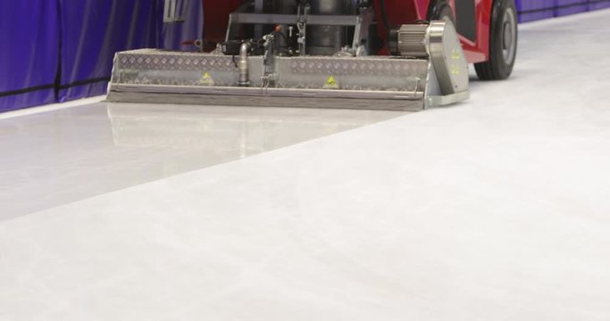 Footage of an ice-resurfacing machine polishing the rink
