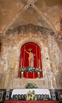 Statue of Christ above an altar inside the San Salvador Cathedral, Jerez de la Frontera, Spain.