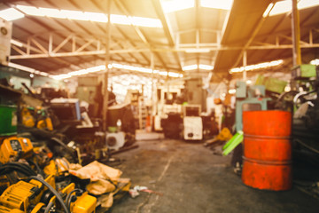 Blur used machinery workshop garage or heavy machine junkyard warehouse for background. - Powered by Adobe