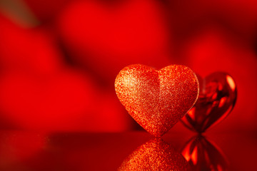 red heart against holiday defocused lights. Valentines day concept.