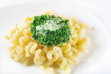 Pasta with spinach and garlick and creamy sauce. Vegetarian food. Healthy food.