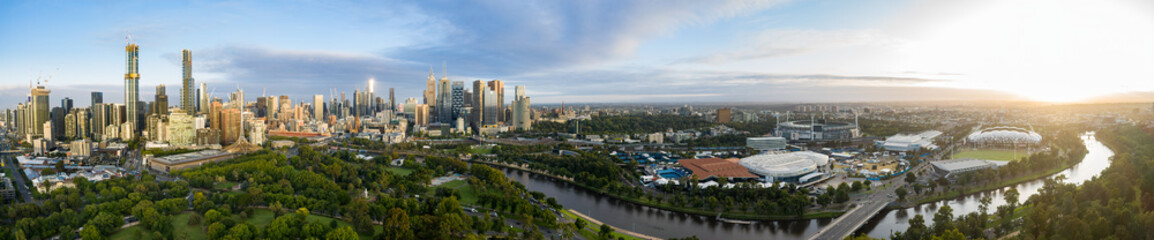 Obraz premium Melbourne Australia February 2nd 2020 : Sweeping aerial panorama of the city of Melbourne, Yarra River and through to AAMI stadium at dawn