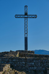 Rocca di Manerba in Garda lake,Italy. Cross on top of a mountain