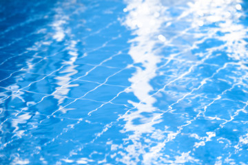 Blurred background of a beautiful blue pool. The concept of recreation, swimming, sports.